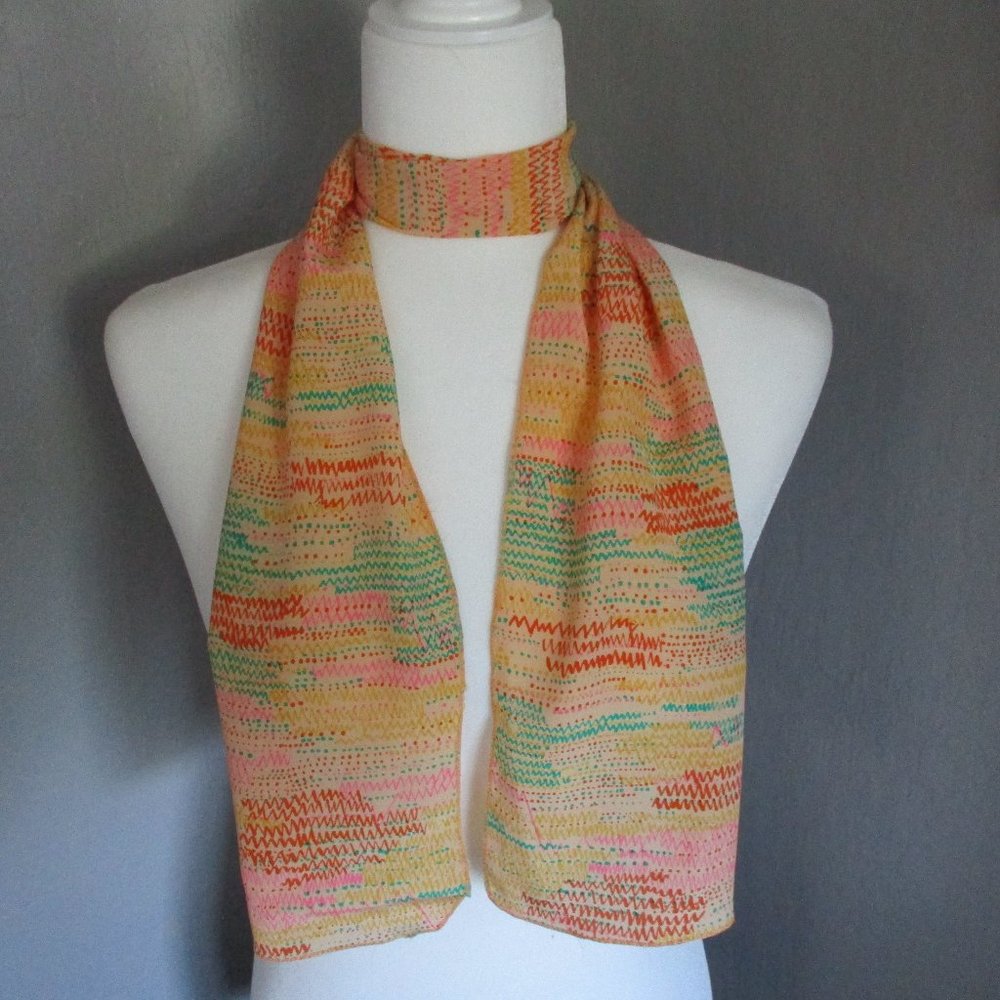 **2/12$** Pink & orange zig-zag scarf